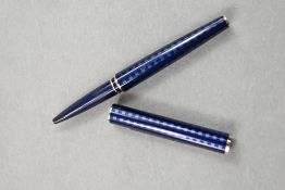 A Louis Vuitton rollerball pen having blue hatch design on darker blue ground, impressed with