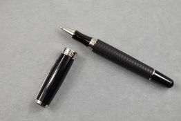 A Chopard rollerball pen. The Chopard rollerball in black resin with silver trim having soft grip to