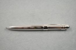 A Chaumet Ballpoint pen having ribbed stainless steel barrel and black faux gem stone detail to cap,