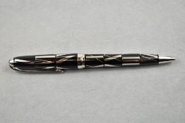 A Louis Cartier Ballpoint pen, with barrel having black ground with silver inlaid Roman numerals,