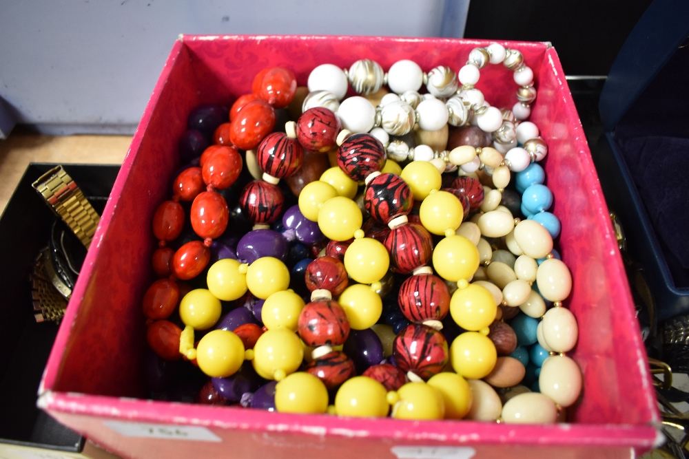 A box of costume beads and necklaces