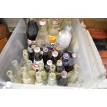 A box of vintage and retro Pepsi bottles, some still having contents!
