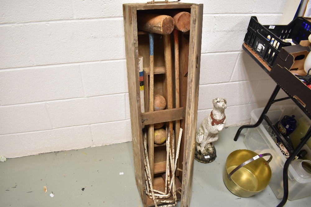 A vintage croquet set in wooden case