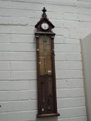 A Victorian Admiral Fitzroy barometer weather station with fitted clock having oak case with