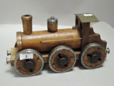 A 20th century Folk Art model of a steam train made from mill bobbins