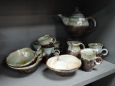A modern Roger Cockram studio pottery part tea service with additional bowls.