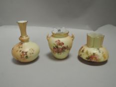 Three pieces of fine Royal Worcester blush ivory including squat vase dated 1887, twin handle urn