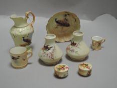 A selection of fine Royal Worcester ceramics including miniature love cup, song bird decorated