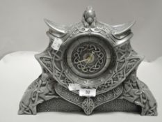 A modern Seamus Moran mantel clock having Celtic design in pewter