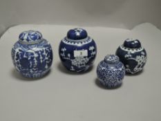 Four Chinese ginger jars having traditional blue and white designs including cracked ice and Peony.