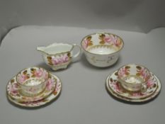 An early 20th century Royal Crown Derby part tea service having decorated gilt and rose design pat