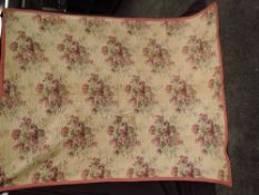 An early 1900s coverlet, backed in cream cotton, using vibrant purple floral cotton to front and