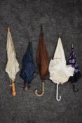 Five vintage umbrellas including frilled lucite handled example, bright floral and one having wooden