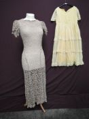 A 1930s coffee coloured lace dress, sheer with puff sleeves and cut on the bias, single button to