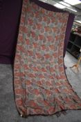 A large Victorian vibrantly patterned crinoline shawl having fringed edge.