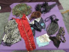 A mixed lot of vintage and antique to include millenary feathers, a peacock feather fan, velvet