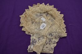 A late Victorian/early Edwardian wire framed lace bonnet or cap.