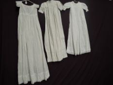 Three Victorian baby gowns.