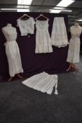A small lot of Victorian undergarments including petticoats and corset cover.