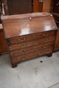 A 19th Century bureau having brass handle and mahogany case with four drawers