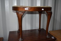 An early 20th Century dressing table stool having Queen Anne style legs and tapestry seat