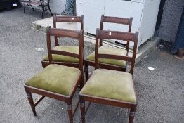 A set of four 19th Century rail back dining chairs