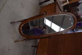 A modern stained frame cheval mirror