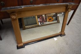 A Victorian over mantel mirror having shell decoration and gilt frame