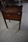 A 19th Century mahogany night stand with storage under drop flap