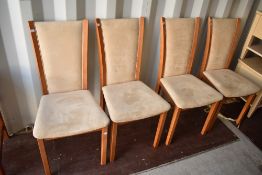 A set of four modern chairs having suedette upholstery