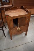 A 19th Century bleached mahogany night stand having pull out drawer potty base