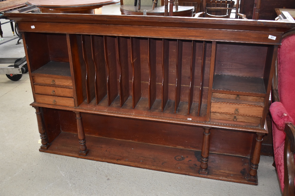 A Victorian mahogany dresser back or shop fitting with segmented centre section, drawers to sides