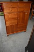 A nice quality modern yew effect side cabinet comprising four drawers over double cupboard,