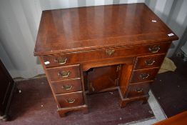 A reproduction period style kneehole desk of small proportions, width approx. 79cm