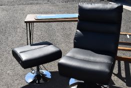 A black vinyl easy chair and footstool on chrome frame