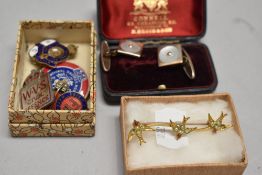 A selection of badges including Womens Voluntary service, a gold tone bar brooch with swallow