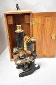 An early 20th century Bausch and Lomb microscope with case.