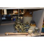 A selection of vintage hardware including salt glazed flagon, brass trivet with kettle, wooden baton