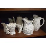 A variety of modern and vintage jugs and vases and a teapot.