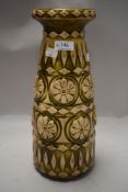 A mid century West German pottery vase Bay pat no 76 35 having daisy pattern with green glaze