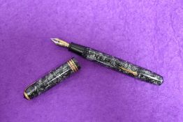 A boxed Conway Stewart 58 lever fill fountain pen in grey hatched design with single broad band