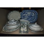 A mixed lot of antique and vintage platters, tureens and a cheese dish having transfer patterns.