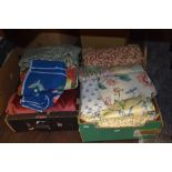 Two boxes full of good quality fabric, predominantly upholstery.