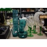 A mid century style aqua green water jug and glass set with a set of six green stem cut glass wine