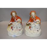 A pair of Victorian Parian ware figures of Red Riding Hood having painted details