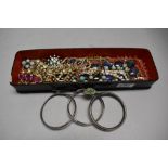 A lacquered glove box containing a selection of vintage and later costume jewellery including