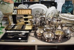 An assortment of plated ware to include boxed fish serving set, tea pots, jugs, tray and more.