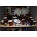 A large quantity of predominantly Victorian lustre and gilt detailed jugs, cups and saucers, bowls