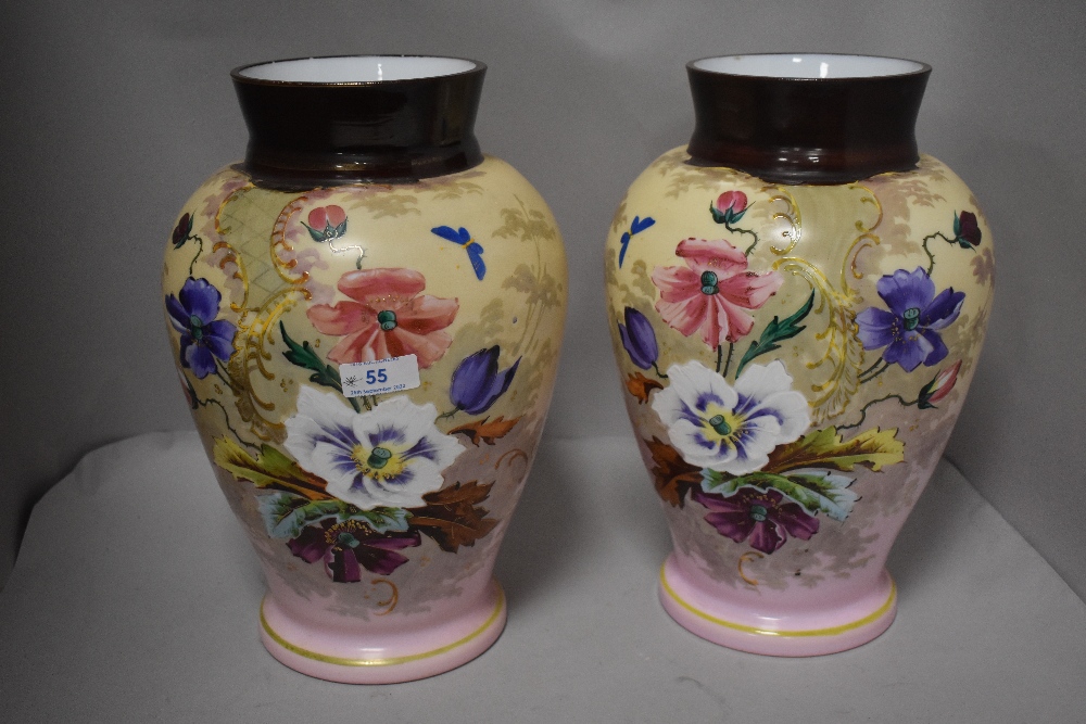 A pair of late Victorian glass vase having mirrored decoration of flowers on pink ground