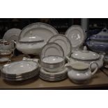 A partial Royal Doulton' York' dinner service to include tureens, bowls, platter,jug and plates.